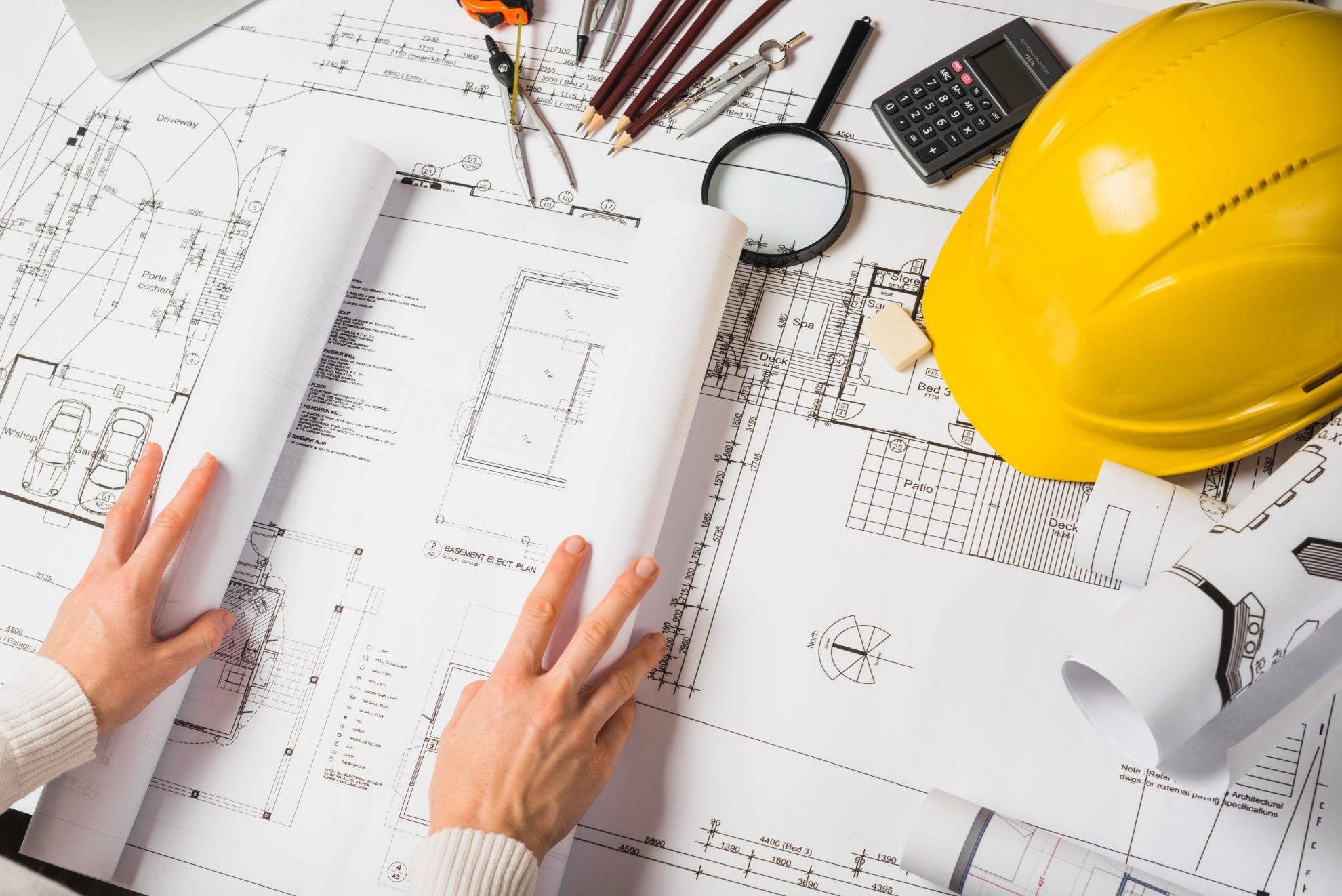 Engineer reviewing fiber network design blueprints